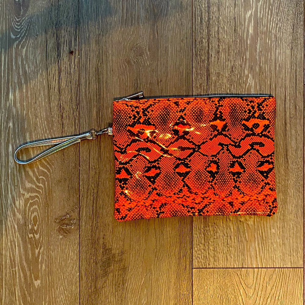 Orange snakeskin handbag